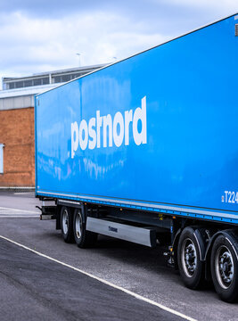 Gothenburg, Sweden - August 07 2026: Blue PostNord freight trailer standing at logistics depot.