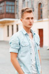 Fototapeta premium Young man in denim clothes outdoors