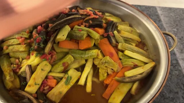 Braised cabbage with carrots and zucchini, tender stew, lightly seasoned, healthy vegetarian dish cooked slowly until very soft and tender, perfect as a main course and very tasty