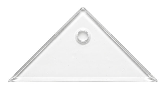 Clear plastic triangular ruler with a circular hole at the top, captured with bright studio lighting on a white background