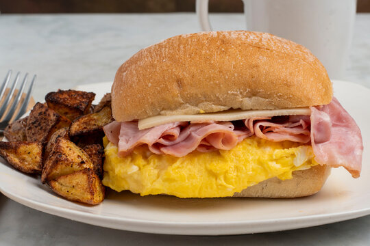 scrable egg and ham sandwich  with home fries