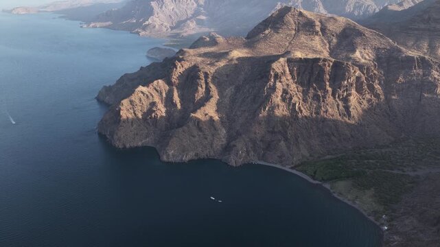 Aerial drone view of the rugged coastal cliffs and ocean at San Evaristo, Baja California Sur.