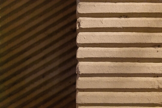 Contrasting ribbed walls with parallel lines and shadows