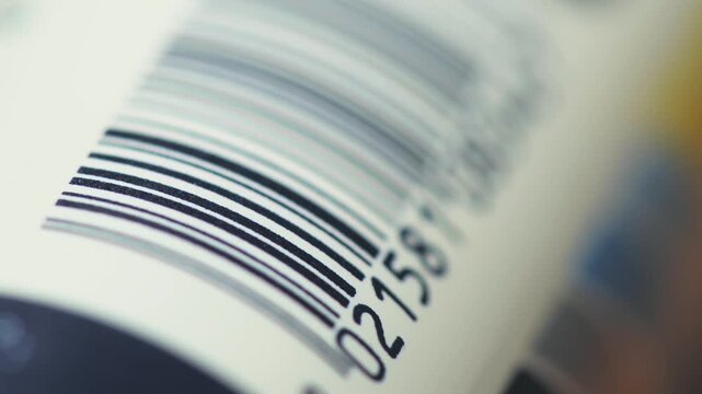 Macro tracking shot of barcode scanning concept on packaging