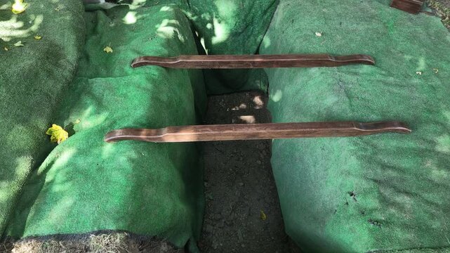 Freshly dug Empty grave with green astroturf