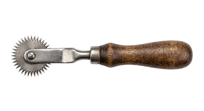 Vintage tracing wheel with a wooden handle and metal spikey disc, used for pattern making, isolated on a white background