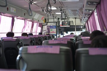 Empty pink seats inside public bus or train interior © 문형 김