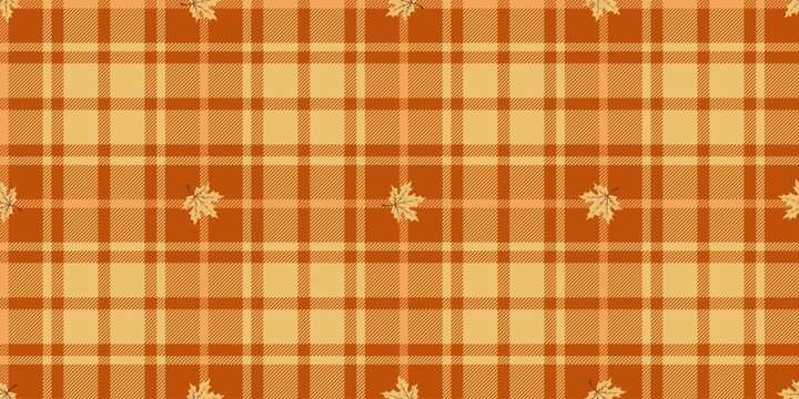 Seamless pattern orange and yellow tartan plaid with leaves. Autumn vector illustration