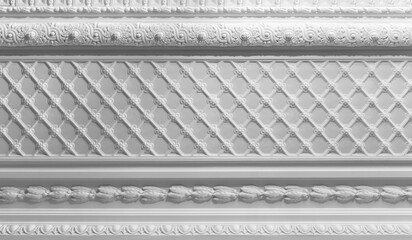 Elegant white plaster ceiling molding featuring a repeating lattice pattern, floral rosettes and carved cornices that showcase classical interior architecture, historic ornamentation © evannovostro