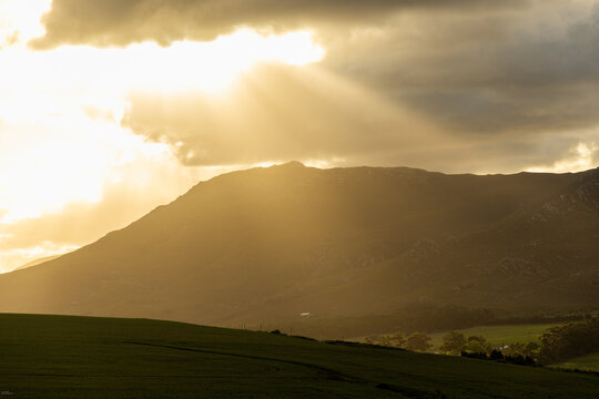 god like sunrays beaming down on farmland and vineyards, Stanford, South Africa