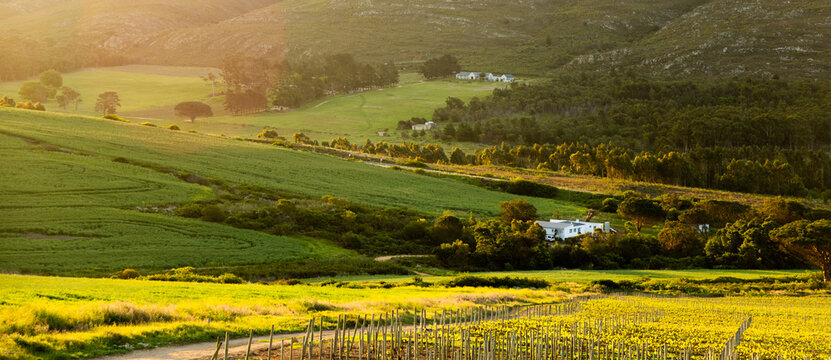 farm land , valley and Klein Mountains, Stanford, South Africa at sunset