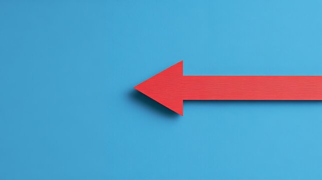 A red arrow points left against a light blue background