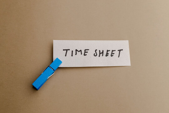 Time sheet note clip pin paperwork business work office job hour clock minute record schedule wage pay salary employment human resource data