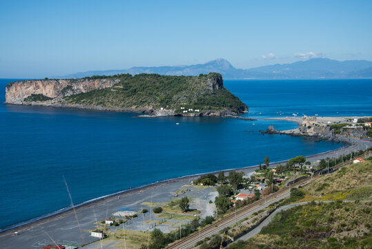 Man looking at Arcomagno natural arch and beach in San Nicola Arcella, Calabria, Italy