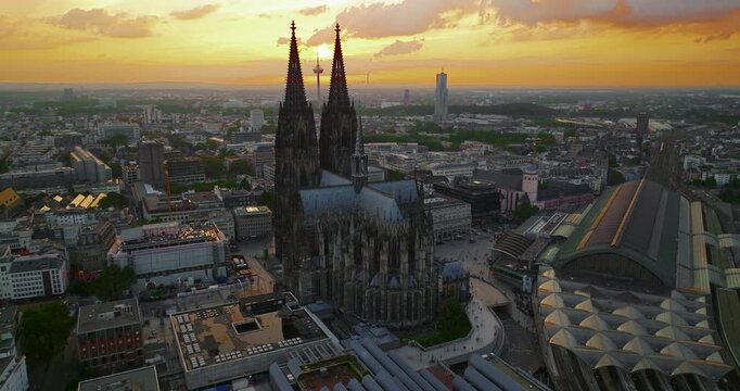 Aerial view of the city of Cologne, featuring Cologne Cathedral at a beautiful sunset