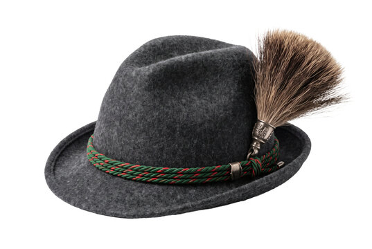 Traditional Bavarian alpine wool felt hat on transparent background, dark grey trachten fedora hat adorned with badger hair gamsbart tuft. Authentic celebration creates proud costume background.