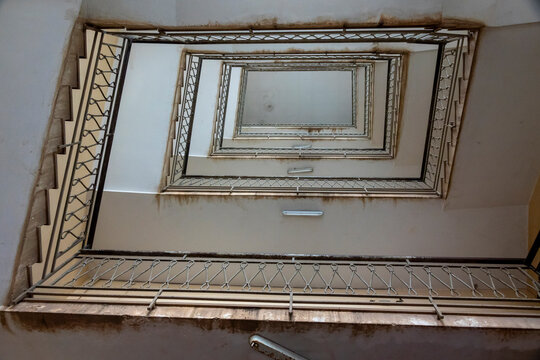A spiral staircase is viewed from below in a striking symmetrical geometric pattern, Central Region, Asmara, Eritrea
