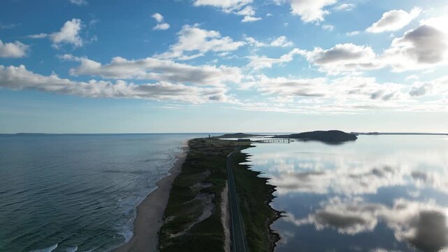 Aerial View of Coastal Road on Magdalen Islands with Sky Reflection