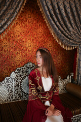 Young girl in luxury traditional Turkish sultan costume in Turkey © Nataliya