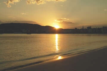 Golden hour on coastal beach © Nina