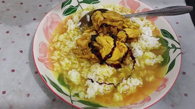 Traditional Indonesian chicken soto topped with sweet soy sauce and chili sauce.