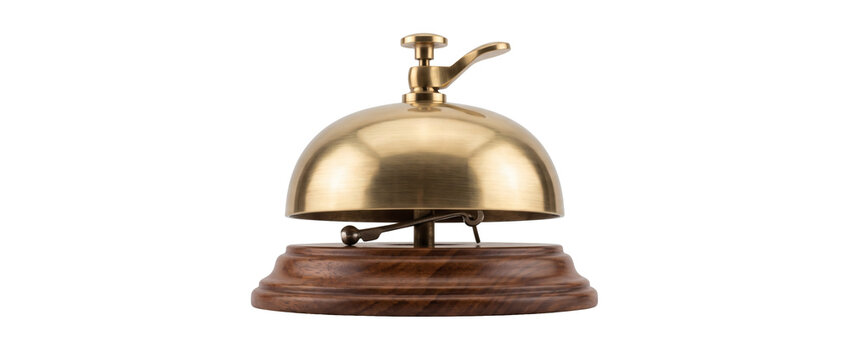 Polished brass counter service bell on dark wooden base on transparent background, classic hotel reception desk bell with circular ringer knob. Luxury assistance creates welcoming reception.