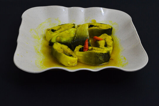 Spicy fish soup with turmeric and cayenne pepper,
