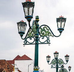 Ornate Street Lamps Against Cloudy Sky © Fabio