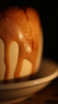 Close-Up Espresso with Creamy Foam and Chocolate Drizzle on Dark Background