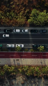 Overhead Drone View of Traffic on Coastal Road
