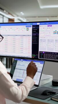 DevOps Engineer Monitors Deployment Pipeline Status On Laptop