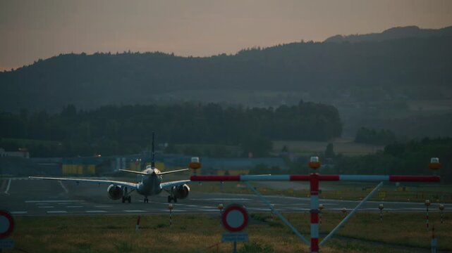 Passenger airplane takes off on an airport runway. Jet taking off from airport runway