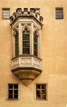 Gothic oriel bay window on historic castle facade