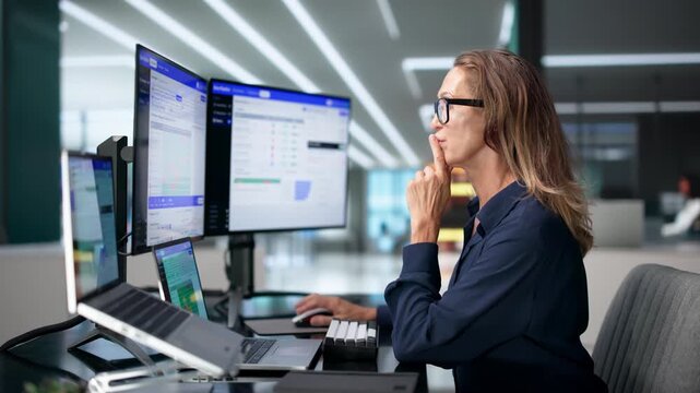 Data Engineer Monitors Real-time Pipeline Workflows Using Laptop