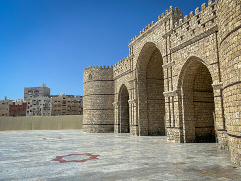 The fortified stone gate of Bab Makkah rises alone over its empty marble esplanade., Makkah, Jeddah, Saudi Arabia