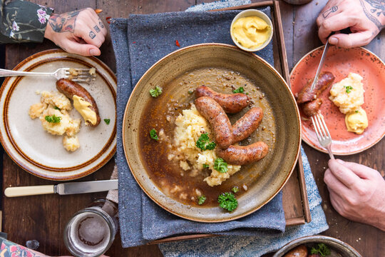 Rustic meal with sausages served.