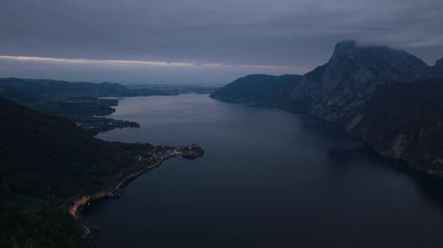 Aerial view of Traunkirchen village on Traunsee lake and Traunstein at dusk