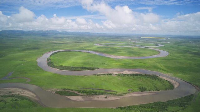 High-Angle Aerial Panoramic View of Meandering River and Sea of Clouds in Zoige Wetland: Yellow River Upper Reaches, Winding Stream, Green Prairie, Blue Sky and Cloud Background