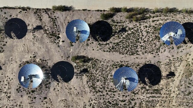 solar power satellite dish antennas in desert landscape