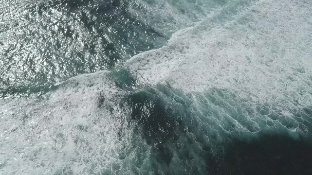 Ocean wave breaking into white foam