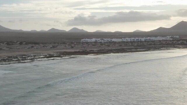 Aerial panorama of a beach and volcanic hills