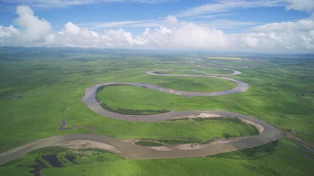 High-Angle Aerial Panoramic View of Meandering River and Sea of Clouds in Zoige Wetland: Yellow River Upper Reaches, Winding Stream, Green Prairie, Blue Sky and Cloud Background