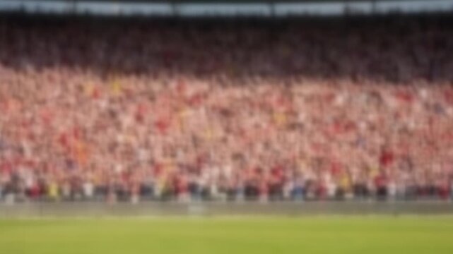 Blurred packed stadium stand of cheering spectators