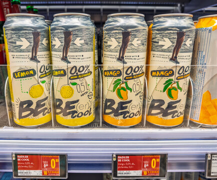 Lubiana, Slovenia- September 9, 2026:  Retail store display of trendy Be Cool radler beverage cans, lemon and mango varieties, marked with percent off discount label