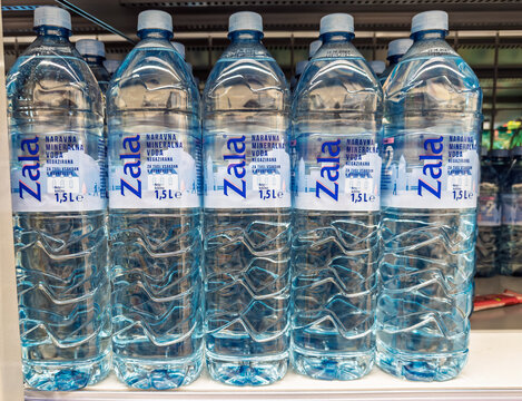 Lubiana, Slovenia- September 9, 2026:  Row of Zala natural still mineral water bottles displayed on supermarket shelf, 1.5 liter Slovenian brand for everyday hydration