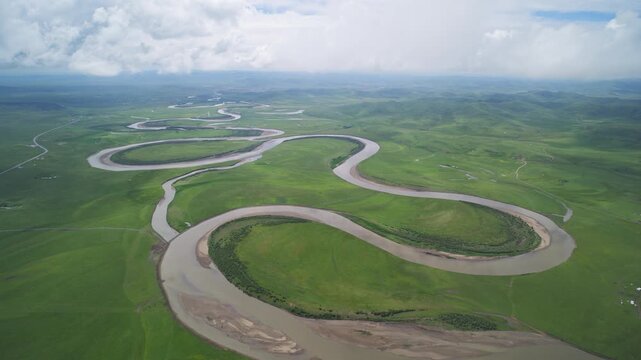 High-Angle Aerial Panoramic View of Meandering River and Sea of Clouds in Zoige Wetland: Yellow River Upper Reaches, Winding Stream, Green Prairie, Blue Sky and Cloud Background
