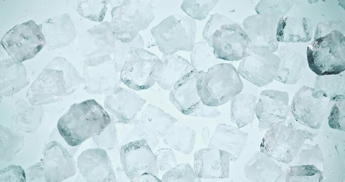 Super slow motion of falling ice cubes separated on black background. Filmed on high speed cinema camera, 1000 fps.