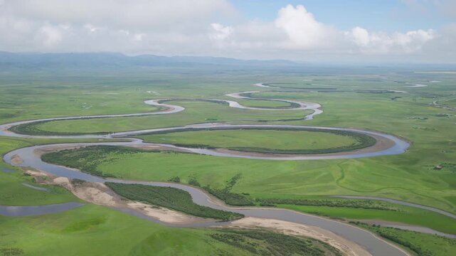 High-Angle Aerial Panoramic View of Meandering River and Sea of Clouds in Zoige Wetland: Yellow River Upper Reaches, Winding Stream, Green Prairie, Blue Sky and Cloud Background