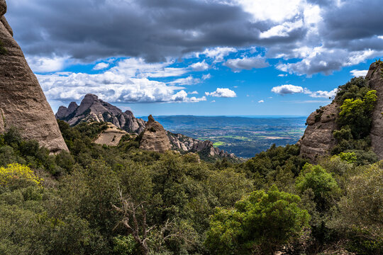 Stunning view of round rocky mountains of Sant Jeron with Catalan Central Depressioni in background at Montserrat near Barcelona in spring, Catalonia, Spain
