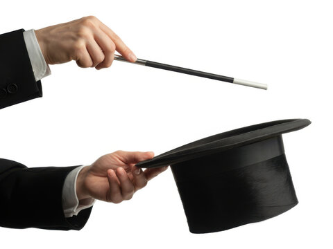 Magician holding a wand over a top hat for a magic trick performance